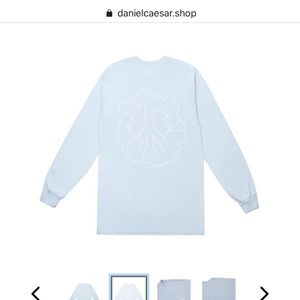 Daniel Caesar “finally found peace” tee
